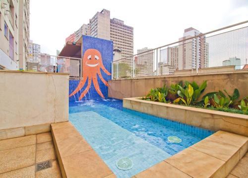 a pool with an octopus painted on the side of a building at Apto com Wi Fi e otima localizacao na Liberdade SP in São Paulo
