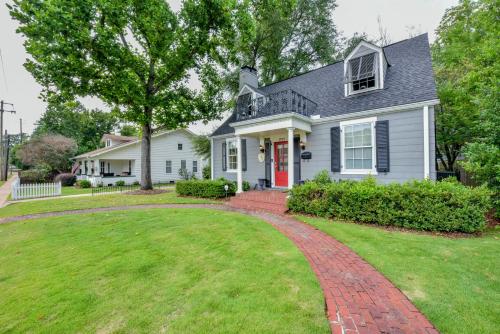 a white house with a red door and a brick driveway at Bama Hideout in Tuscaloosa