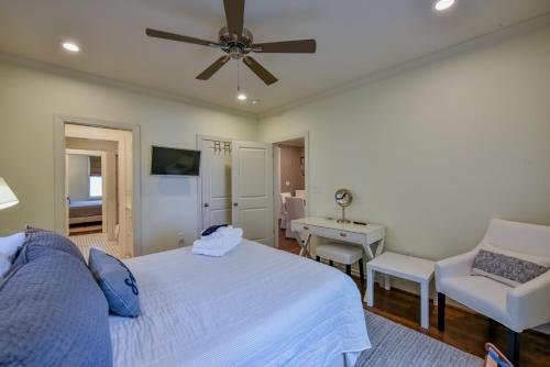 a bedroom with a bed and a ceiling fan at Bama Hideout in Tuscaloosa