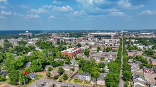 an aerial view of a town with trees and buildings at Bama Hideout in Tuscaloosa