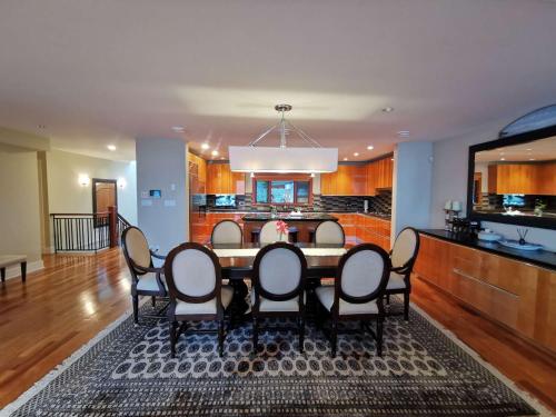 a dining room with a table and chairs at Deep Cove Stunning Waterfront Whole House in North Vancouver