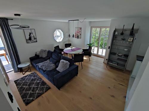a living room with a couch and a table at Villa Florentina in Bad Wörishofen