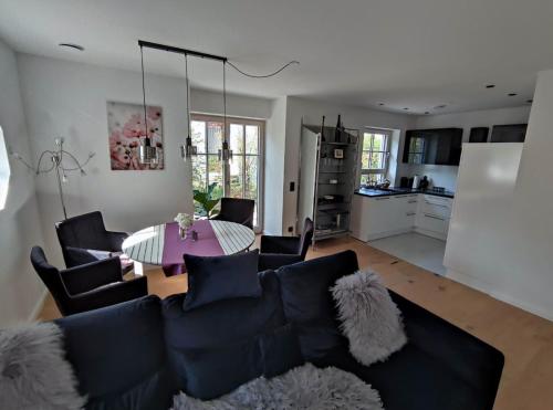 a living room with a couch and a table at Villa Florentina in Bad Wörishofen