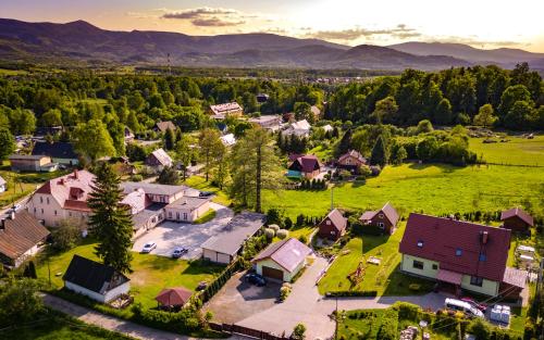 an aerial view of a small village with houses at Górska Chatka in Bukowiec