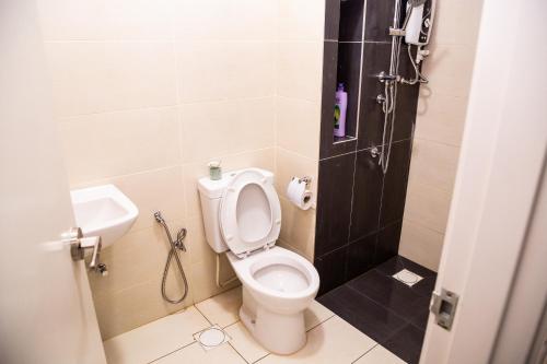 a bathroom with a toilet and a shower at Entire Unit PJ PacificTower Pool Parking Opp JayaOne in Petaling Jaya