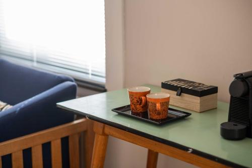 two cups on a tray on a table at Belle de Nuit in Ostend