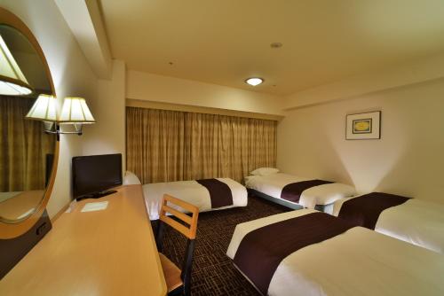 Łóżko lub łóżka w pokoju w obiekcie Canal City Fukuoka Washington Hotel