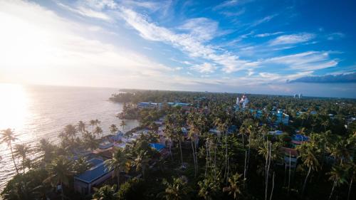 an aerial view of a resort next to the water at Venitia Homestay in Alleppey