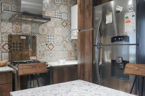 Dapur atau dapur kecil di Aparts Calafate Suites