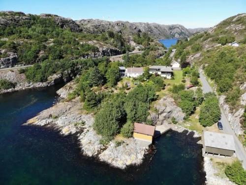 an aerial view of a house on a hill by the water at Havgaarden, apt 1 in Stapnes