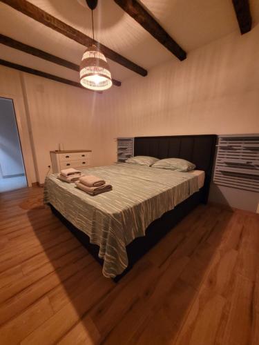 a bedroom with a large bed in a room at Villa Bosna Near Dubrovnik very beautiful Villa entirely privatized swimming pool, jacuzzi, sauna, billiard, ping-pong in Ivanica