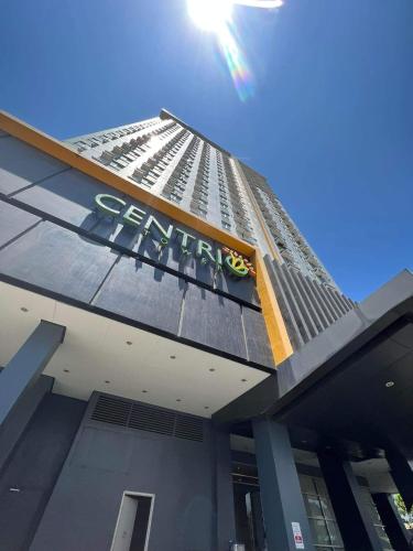 a tall building with a sign on top of it at 1 BR Centrio Tower 926 in Cagayan de Oro
