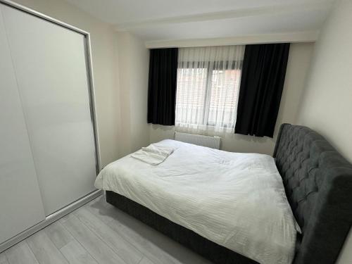 Ένα ή περισσότερα κρεβάτια σε δωμάτιο στο Rose Plus Residence