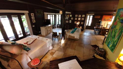 a woman laying on a bed in a room at Siri Paraiso Hotel in Touros