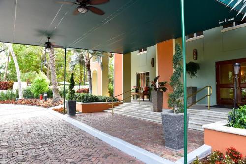 a courtyard of a building with stairs and plants at Ocean View 2bd2bth Hotel In Coconut Grove in Miami