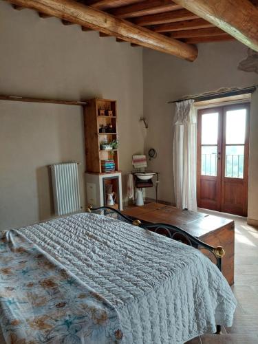 a bedroom with a large bed in a room at Ca' Növa in Valverde Pavia