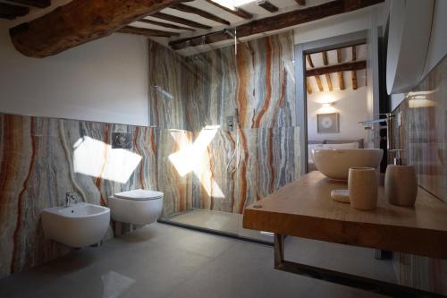 a bathroom with two sinks and two toilets at New Moon Rooms in La Spezia