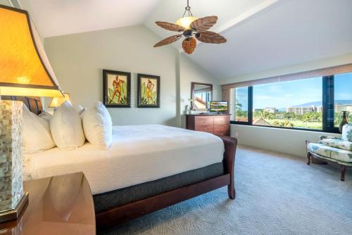 a bedroom with a bed and a large window at KBM Resorts KRO-K302 2B Villa with free Rental car in Kaanapali