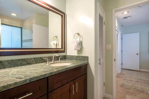 a bathroom with a sink and a mirror at KBM Resorts KRO-K302 2B Villa with free Rental car in Kaanapali