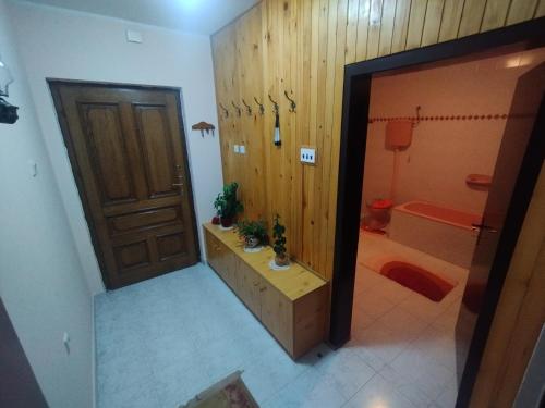 a bathroom with a shower and a toilet and a door at Libero house in Smederevo