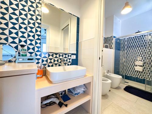 a bathroom with a sink and a toilet at La Campanella - De Vivo Realty in Termini