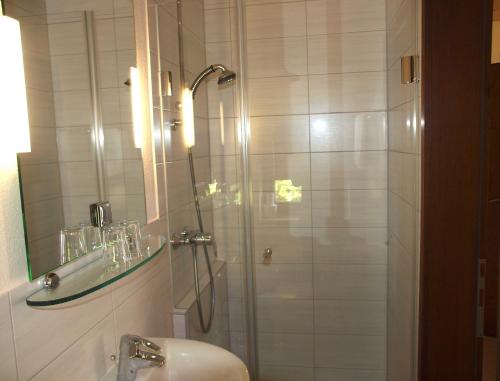 a bathroom with a shower and a sink at Bio & Vegi Pension Krennleiten in Schönau am Königssee