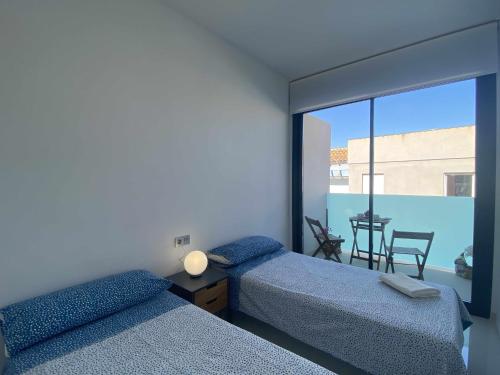 Posteľ alebo postele v izbe v ubytovaní Impresionante piso en el centro de Torrevieja
