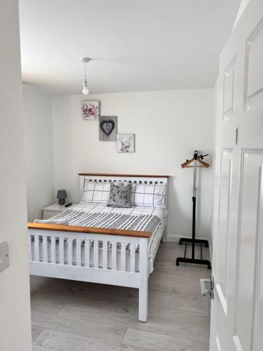 a bedroom with a white bed in a room at Sleep In oxford in Oxford