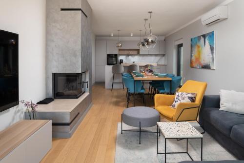 a living room with a couch and a table at Villa Voyage in Zadar