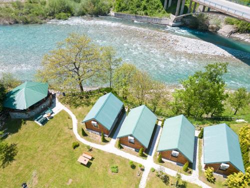 an overhead view of a group of buildings next to a river at Tara Riverside in Mojkovac