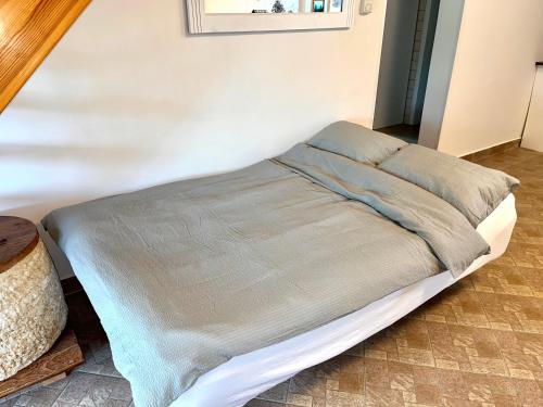 Postel nebo postele na pokoji v ubytování Olive Garden House 1