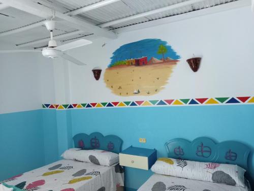 Postel nebo postele na pokoji v ubytování Sabaha Kato