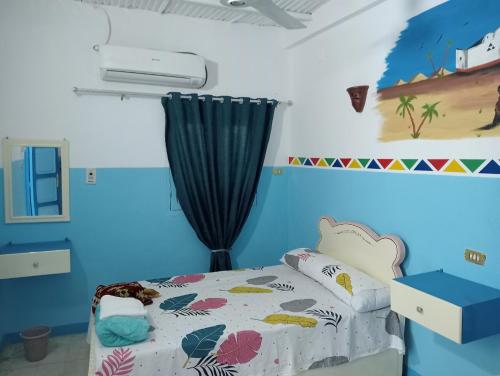 Postel nebo postele na pokoji v ubytování Sabaha Kato