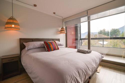 Ένα ή περισσότερα κρεβάτια σε δωμάτιο στο Departamento Origen Pucon