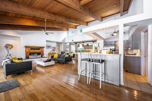 an open kitchen and living room with wood ceilings at Mount Dora - Lake Jem in Mount Dora