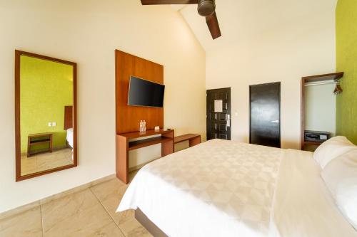 Postel nebo postele na pokoji v ubytování Villas Coral Huatulco