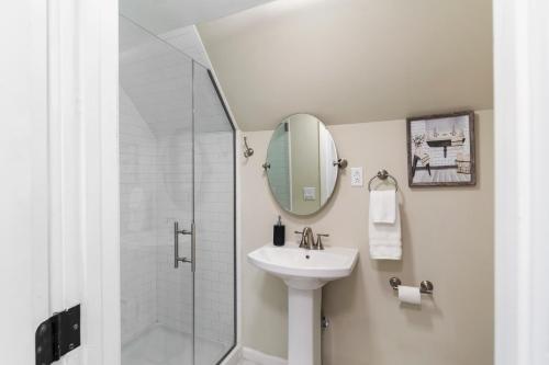 a bathroom with a sink and a shower at Fantastic retreat 5min from Village w/ media room! in Stowe
