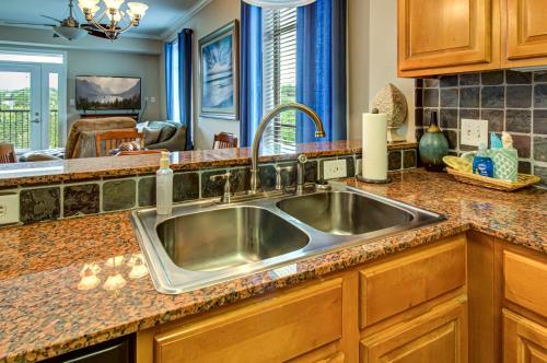 a kitchen with a stainless steel sink in a kitchen at River Crossing #405 in Pigeon Forge