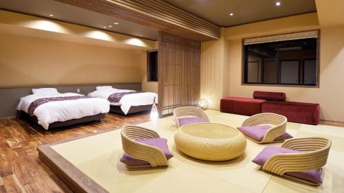 Ένα ή περισσότερα κρεβάτια σε δωμάτιο στο Ryokan Okayama