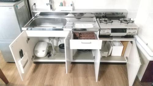 Una cocina o cocineta en Maple Sumikawa #202