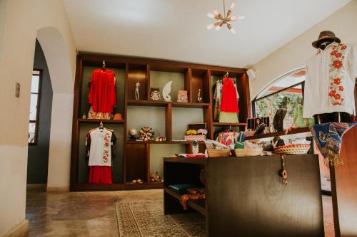a store with clothes on display in a room at Hotel Holly in Mérida