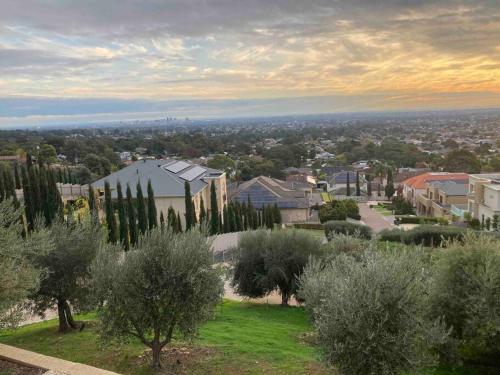 a view of a city with trees and buildings at Adelaide and Adelaide Hills self contained private guest suite in Montacute