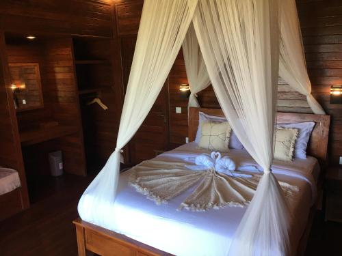 Кровать или кровати в номере Sunset Hill Lembongan