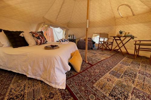 a bedroom with a bed in a tent at Kokoon Retreats - Northern Rivers NSW in Bilambil Heights