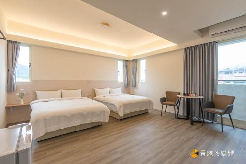 Muguang Elevator Homestay tesisinde bir odada yatak veya yataklar