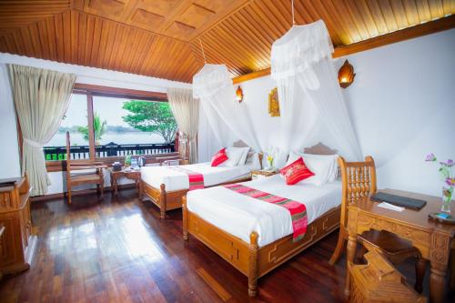 Cama o camas de una habitación en KMA Kaytumadi Hotel
