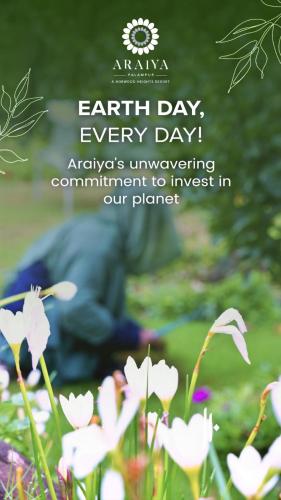 a sign that says earth day every day with flowers at Araiya Palampur in Pālampur