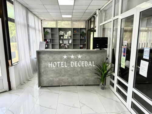 a hotel decedel sign in the lobby of a building at Hotel Decebal Eforie Nord in Eforie Nord