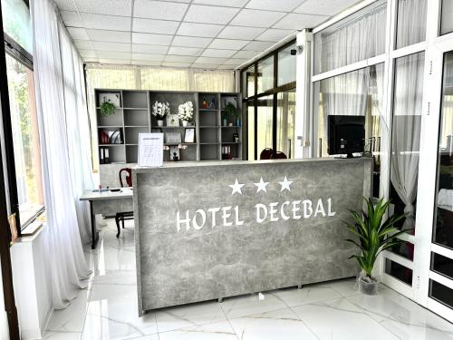 a hotel decedel sign in a hotel lobby at Hotel Decebal Eforie Nord in Eforie Nord