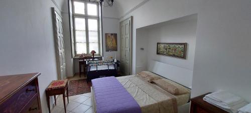 Postel nebo postele na pokoji v ubytování YNH Bilo SanCarlo Museo Egizio Piazza San Carlo